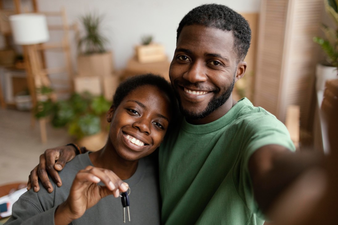 smiley-couple-taking-selfie-their-new-home